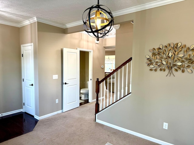 150 Shawnee Dr, Pickerington, OH 43147 - foyer featuring a chandelier, baseboards, carpet flooring, stairs, and crown molding