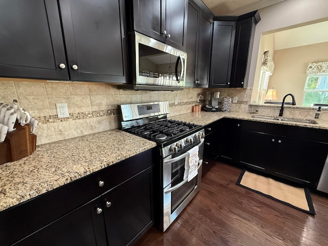 150 Shawnee Dr, Pickerington, OH 43147 - kitchen with stainless steel appliances, a sink, and dark cabinetry