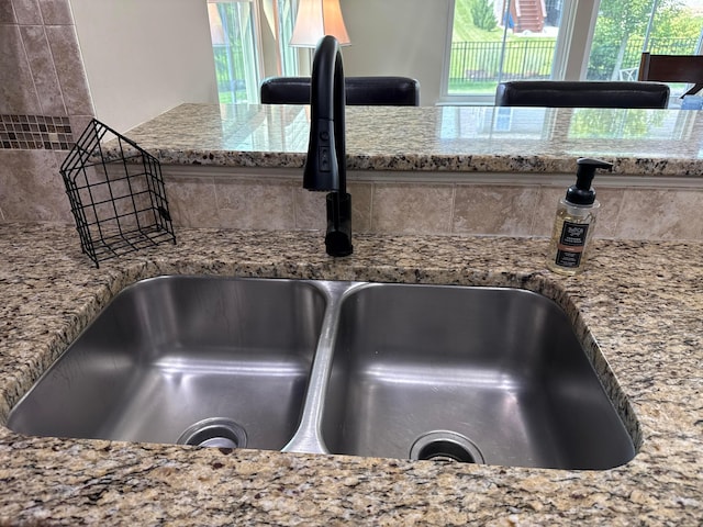 150 Shawnee Dr, Pickerington, OH 43147 - kitchen view of a sink, decorative backsplash, and light stone countertops