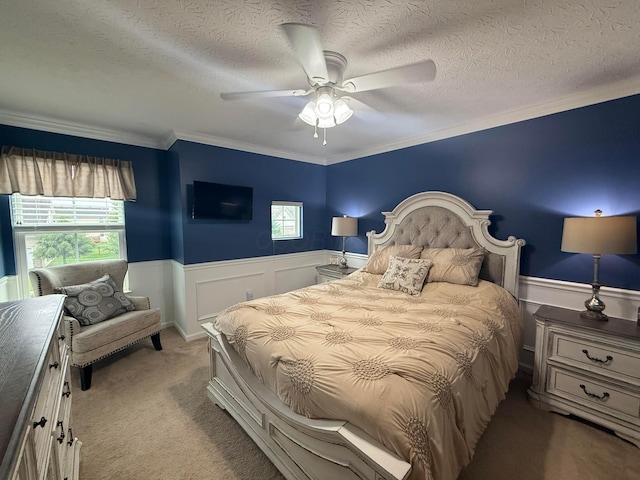 150 Shawnee Dr, Pickerington, OH 43147 - bedroom featuring a wainscoted wall, multiple windows, crown molding, a textured ceiling, and ceiling fan
