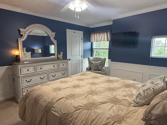 150 Shawnee Dr, Pickerington, OH 43147 - bedroom featuring wainscoting, carpet floors, multiple windows, crown molding, and a ceiling fan