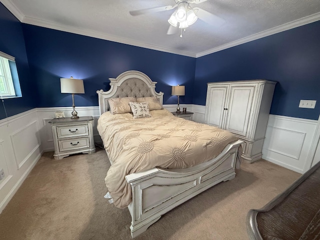 150 Shawnee Dr, Pickerington, OH 43147 - bedroom with light carpet, wainscoting, crown molding, a ceiling fan, and a textured ceiling