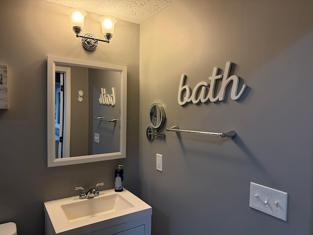 150 Shawnee Dr, Pickerington, OH 43147 - bathroom featuring vanity, toilet, and a textured ceiling