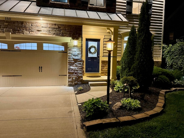 150 Shawnee Dr, Pickerington, OH 43147 - doorway to property featuring a standing seam roof, stone siding, metal roof, and driveway