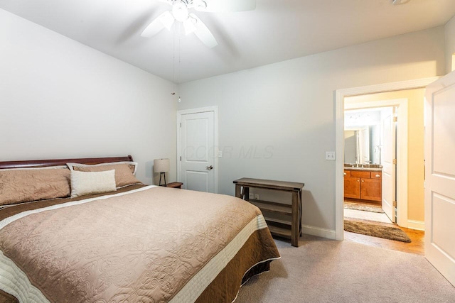 10 E Weber Rd Unit 205, Columbus, OH 43202 - bedroom with light carpet, baseboards, and ceiling fan