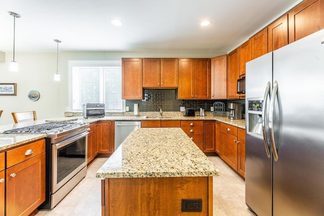 10 E Weber Rd Unit 205, Columbus, OH 43202 - kitchen with stainless steel appliances, a sink, brown cabinets, light tile patterned flooring, and recessed lighting