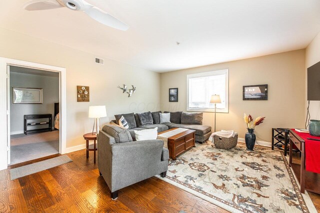 10 E Weber Rd Unit 205, Columbus, OH 43202 - living area with wood finished floors, baseboards, and ceiling fan