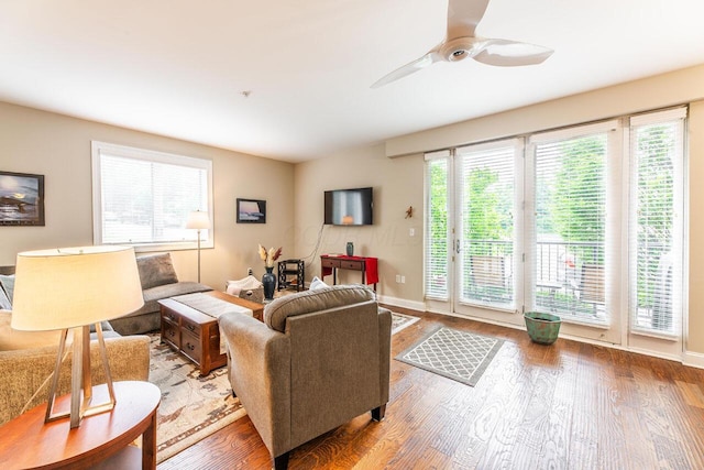 10 E Weber Rd Unit 205, Columbus, OH 43202 - living room with wood finished floors, healthy amount of natural light, ceiling fan, and baseboards