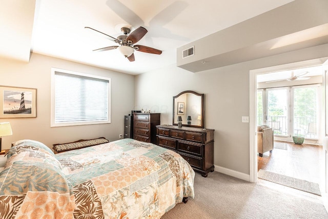 10 E Weber Rd Unit 205, Columbus, OH 43202 - bedroom featuring baseboards, light carpet, and a ceiling fan