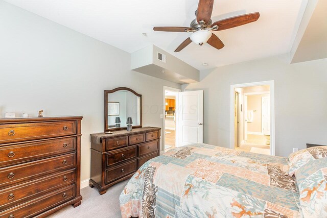 10 E Weber Rd Unit 205, Columbus, OH 43202 - bedroom featuring light colored carpet, ensuite bathroom, baseboards, and a ceiling fan