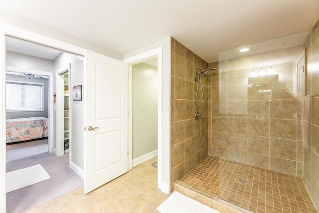 10 E Weber Rd Unit 205, Columbus, OH 43202 - ensuite bathroom with tiled shower, tile patterned floors, and baseboards