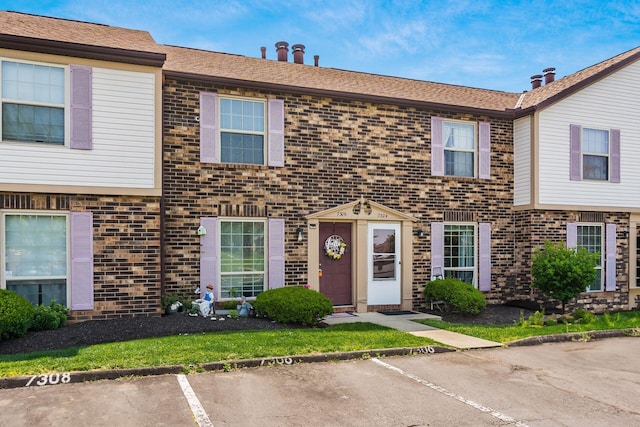 7306 Cimmaron Sta, Columbus, OH 43235 - townhome / multi-family property featuring brick siding and uncovered parking