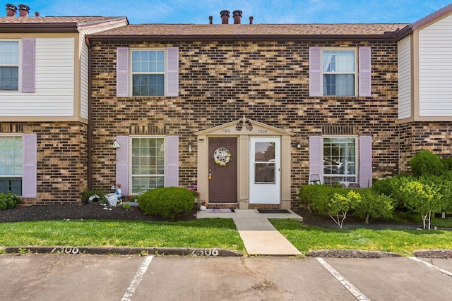 7306 Cimmaron Sta, Columbus, OH 43235 - multi unit property featuring brick siding and uncovered parking