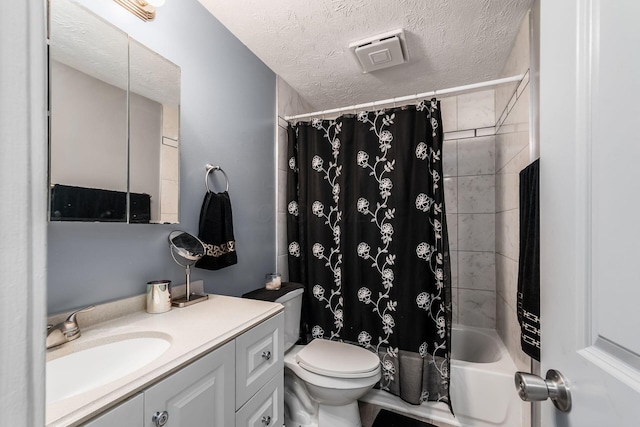 7306 Cimmaron Sta, Columbus, OH 43235 - full bathroom featuring toilet, vanity, a textured ceiling, and shower / tub combo with curtain