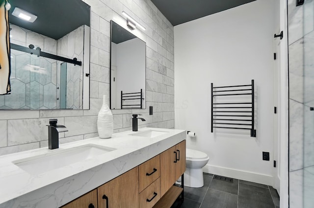 158 Punta Aly, Columbus, OH 43201 - bathroom featuring radiator, tile patterned floors, a stall shower, toilet, and double vanity