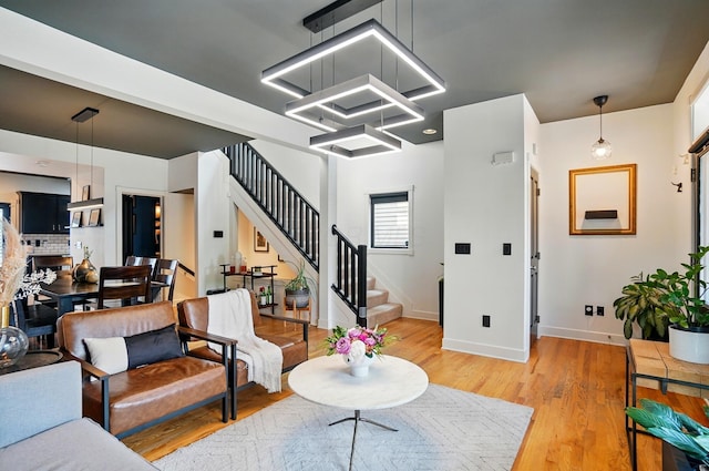 158 Punta Aly, Columbus, OH 43201 - living area featuring stairway, baseboards, and light wood-style flooring