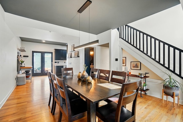 158 Punta Aly, Columbus, OH 43201 - dining room with light wood-style flooring, stairway, and baseboards