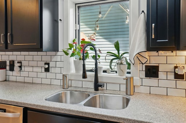 158 Punta Aly, Columbus, OH 43201 - kitchen with a sink, light countertops, decorative backsplash, and stainless steel dishwasher