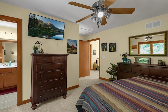 3850 Alward Rd SW, Pataskala, OH 43062 - bedroom featuring light colored carpet, baseboards, connected bathroom, and ceiling fan