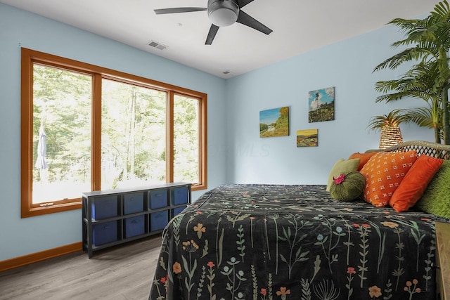 3850 Alward Rd SW, Pataskala, OH 43062 - bedroom with light wood finished floors, baseboards, and ceiling fan