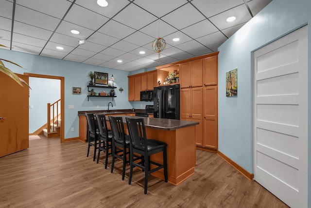 3850 Alward Rd SW, Pataskala, OH 43062 - kitchen featuring open shelves, black appliances, baseboards, dark countertops, and recessed lighting