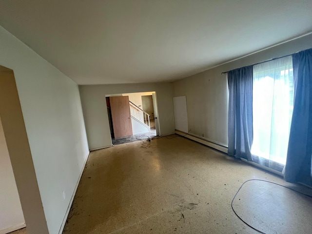5340 Edgeview Rd, Columbus, OH 43207 - spare room with healthy amount of natural light, baseboard heating, and stairs