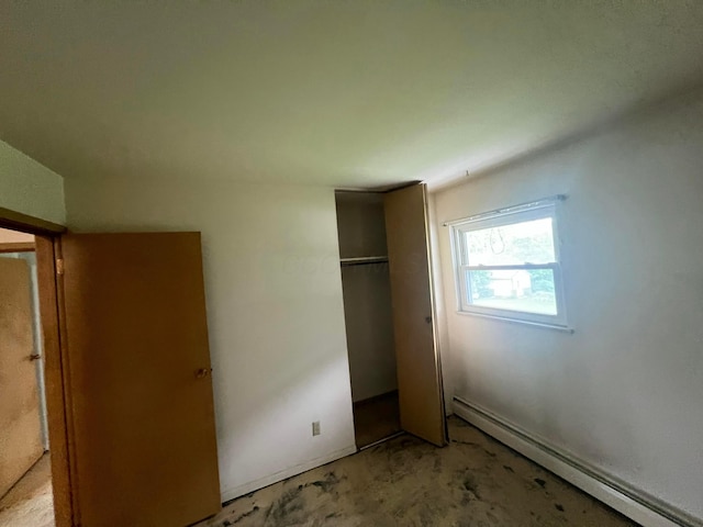 5340 Edgeview Rd, Columbus, OH 43207 - unfurnished bedroom with a baseboard heating unit and a closet