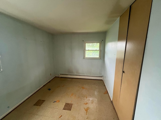5340 Edgeview Rd, Columbus, OH 43207 - unfurnished bedroom featuring a baseboard radiator and baseboards