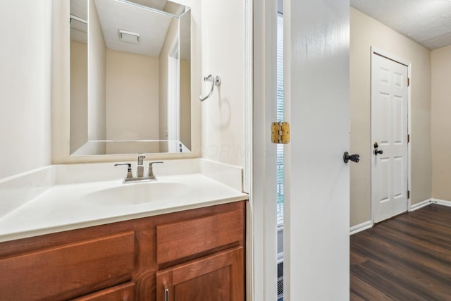 5905 Shadow Lake Cir, Columbus, OH 43235 - bathroom with wood finished floors, vanity, and baseboards
