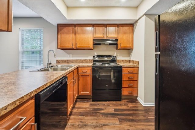 5905 Shadow Lake Cir, Columbus, OH 43235 - kitchen featuring black appliances, under cabinet range hood, a sink, dark wood finished floors, and brown cabinets