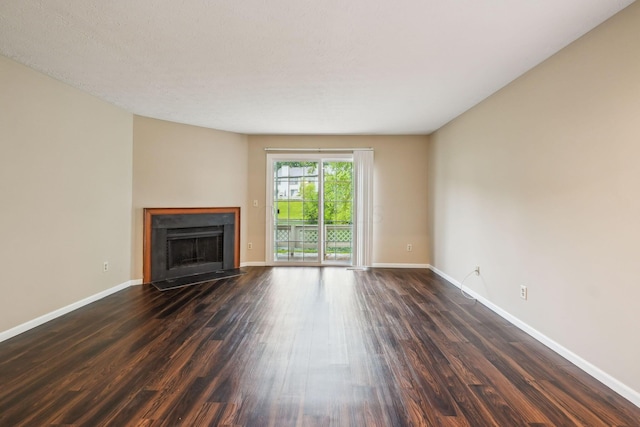 5905 Shadow Lake Cir, Columbus, OH 43235 - unfurnished living room featuring a fireplace with flush hearth, dark wood-style floors, and baseboards