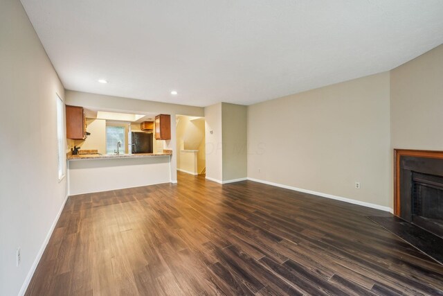 5905 Shadow Lake Cir, Columbus, OH 43235 - unfurnished living room featuring a fireplace with flush hearth, dark wood-style flooring, baseboards, and recessed lighting