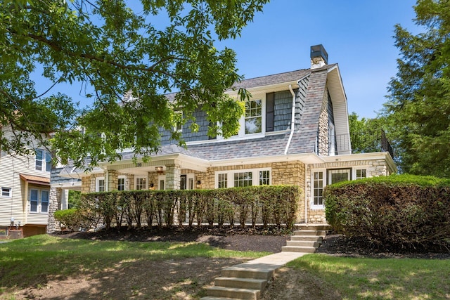 320 Rhoads Ave, Columbus, OH 43205 - view of front of property with stone siding, a gambrel roof, and a chimney