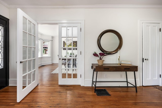 320 Rhoads Ave, Columbus, OH 43205 - entrance foyer featuring crown molding, wood finished floors, and baseboards