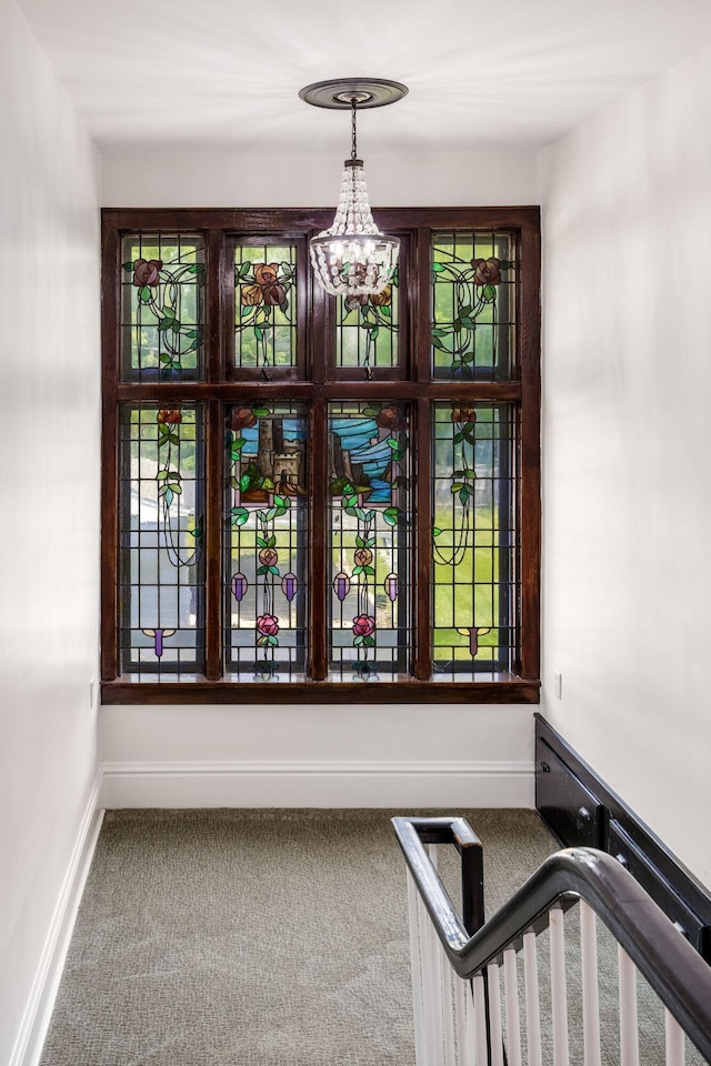 320 Rhoads Ave, Columbus, OH 43205 - detailed view of carpet, baseboards, and a chandelier