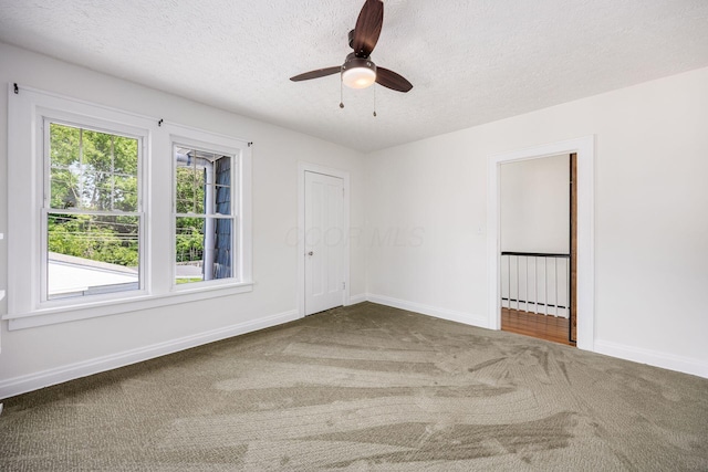 320 Rhoads Ave, Columbus, OH 43205 - unfurnished room featuring carpet floors, a textured ceiling, baseboards, and a ceiling fan