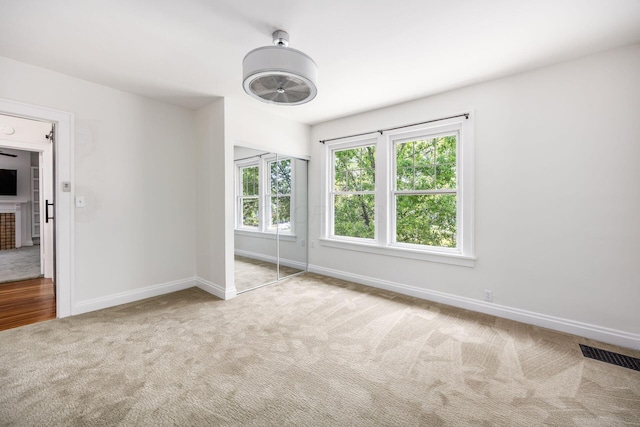 320 Rhoads Ave, Columbus, OH 43205 - unfurnished bedroom featuring carpet flooring, baseboards, and a closet