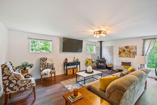 135 State Route 229, Waldo, OH 43356 - living area featuring a wood stove, wood finished floors, and baseboards