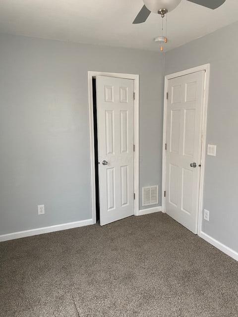 2691 Howey Rd, Columbus, OH 43211 - carpeted empty room with a ceiling fan and baseboards