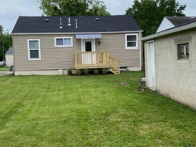 2691 Howey Rd, Columbus, OH 43211 - back of house featuring a yard, crawl space, and a shingled roof