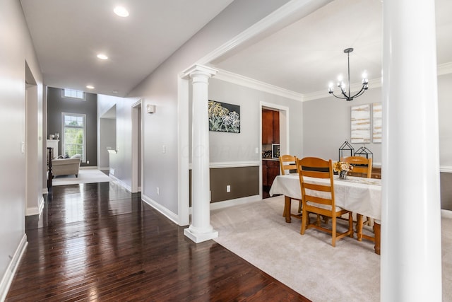 7685 Skarlocken Grn, New Albany, OH 43054 - dining room featuring hardwood / wood-style floors, ornate columns, a chandelier, recessed lighting, and ornamental molding