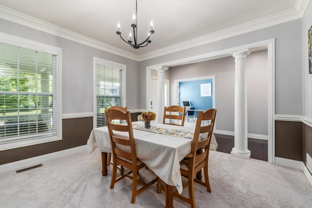 7685 Skarlocken Grn, New Albany, OH 43054 - carpeted dining area featuring ornate columns, crown molding, and a chandelier