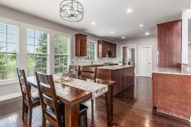 7685 Skarlocken Grn, New Albany, OH 43054 - dining area with dark wood-style floors, a chandelier, and recessed lighting