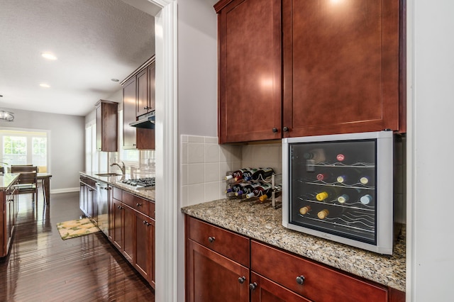 7685 Skarlocken Grn, New Albany, OH 43054 - kitchen featuring backsplash, recessed lighting, dark wood-style flooring, stainless steel appliances, and light stone counters