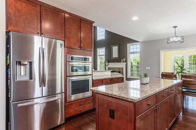 7685 Skarlocken Grn, New Albany, OH 43054 - kitchen featuring stainless steel appliances, dark wood-type flooring, plenty of natural light, recessed lighting, and lofted ceiling