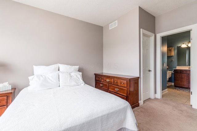 7685 Skarlocken Grn, New Albany, OH 43054 - bedroom with light colored carpet and ensuite bathroom