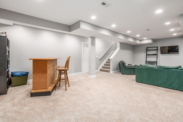 7685 Skarlocken Grn, New Albany, OH 43054 - carpeted living area with a dry bar, recessed lighting, and stairs