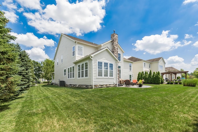 7685 Skarlocken Grn, New Albany, OH 43054 - rear view of property with a gazebo, a patio area, a chimney, and a yard