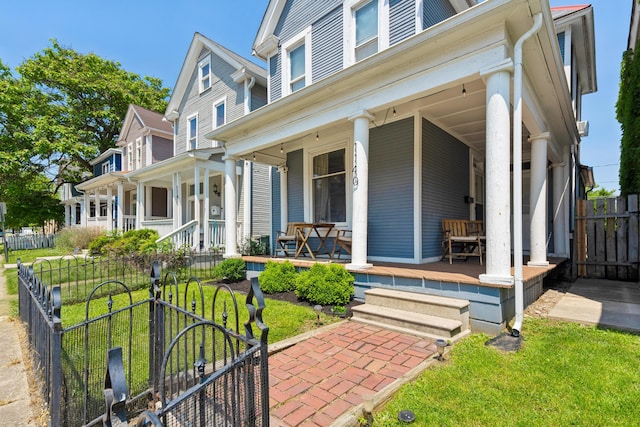 1140 Summit St, Columbus, OH 43201 - view of front of home featuring a porch and a gate