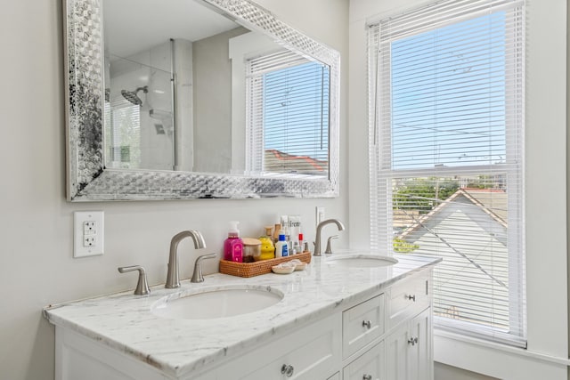 1140 Summit St, Columbus, OH 43201 - bathroom with double vanity and a shower with shower door